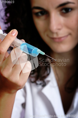 Image of Portrait of a young doctor with syringa.