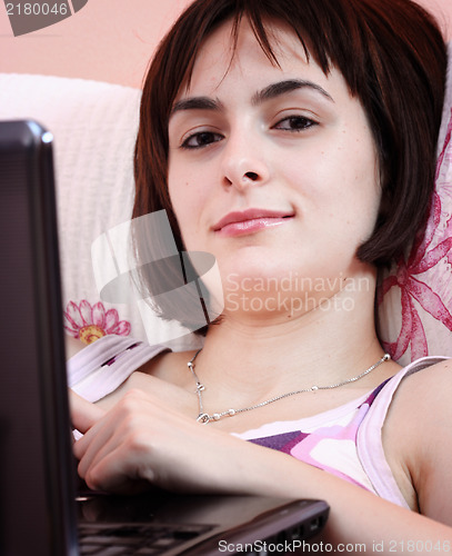 Image of Young woman with laptop 