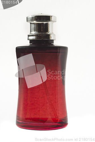 Image of perfume in red bottle