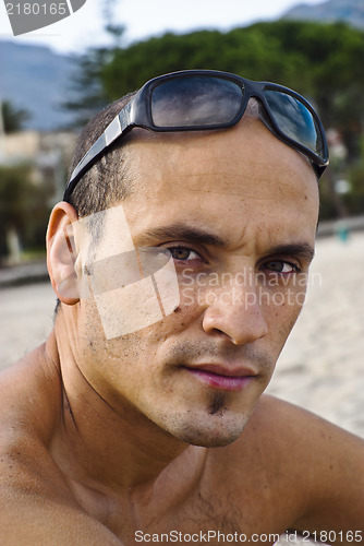 Image of handsome man with sunglasses on head