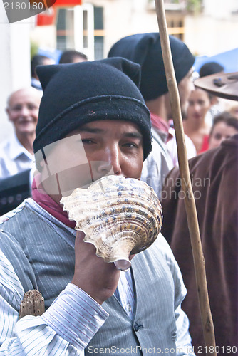 Image of Portuguese folk group. Men plays a shall