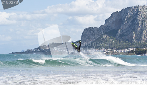 Image of Man jumps on the jet ski