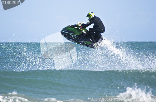 Image of Man jumps on the jet ski