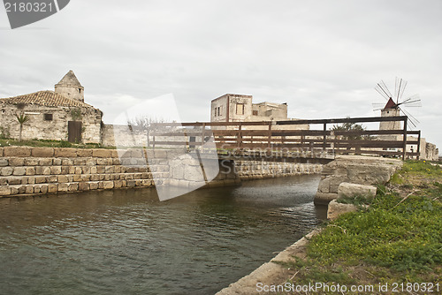 Image of Old windmill  with lake and bridge