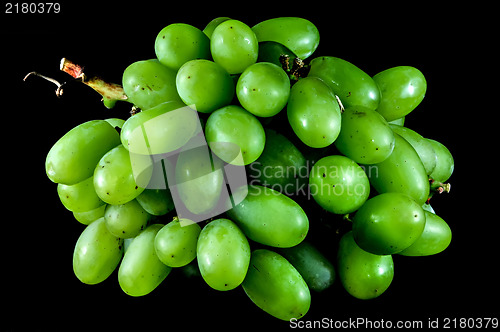 Image of bunch of green grapes on a black background