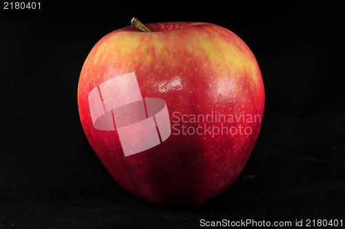 Image of fresh red apple on black background