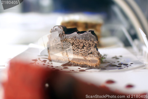 Image of chocolate cheese cake slice on display