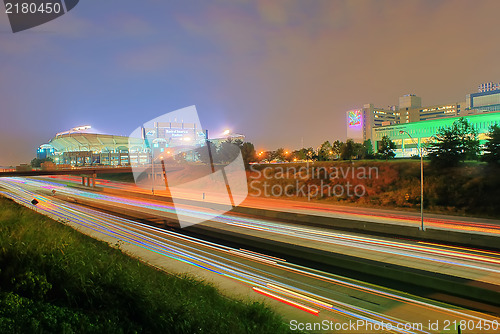 Image of charlotte skyline at night with highway traffic