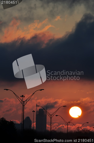 Image of dramatic sunrise over city