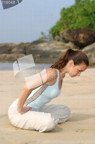 Image of Young woman exercising