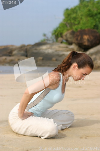 Image of Young woman exercising