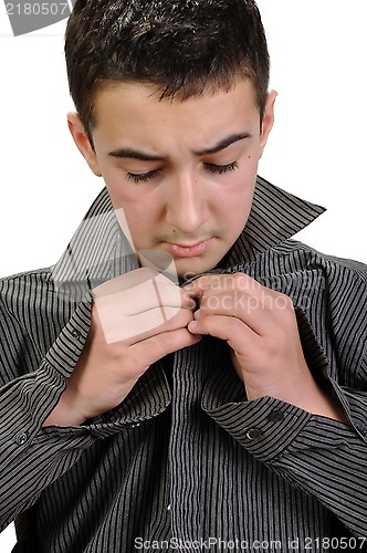 Image of teenager boy dressing up