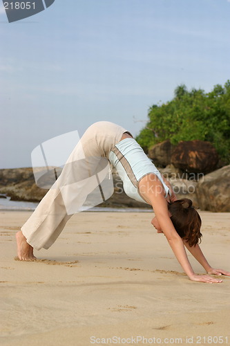 Image of Young woman exercising