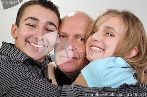 Image of family portrait of elderly father with children