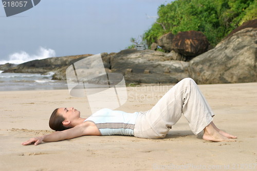 Image of Young woman exercising