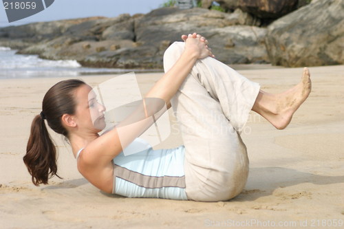 Image of Young woman exercising