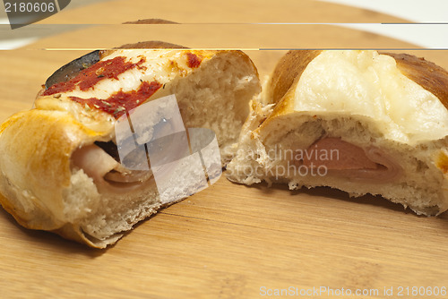 Image of Sicilian rotisserie. pieces of rotisserie on wooden board