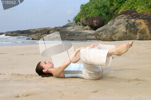 Image of Young woman exercising