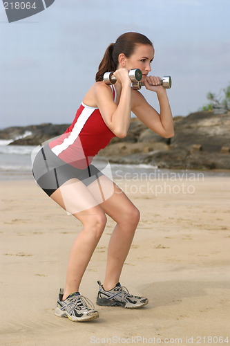 Image of Young woman exercising