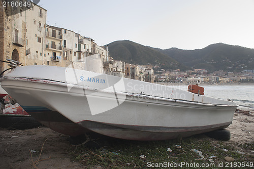 Image of Bay of cefalu with old boat.