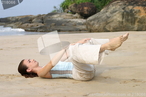 Image of Young woman exercising