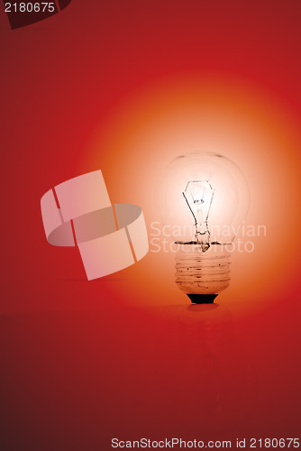 Image of light bulb on a red background