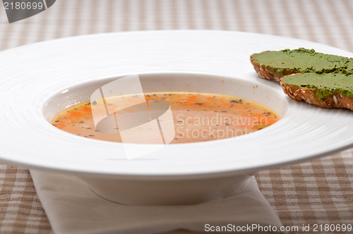 Image of Italian minestrone soup with pesto crostini on side
