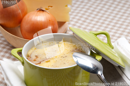 Image of onion soup with melted cheese and bread on top
