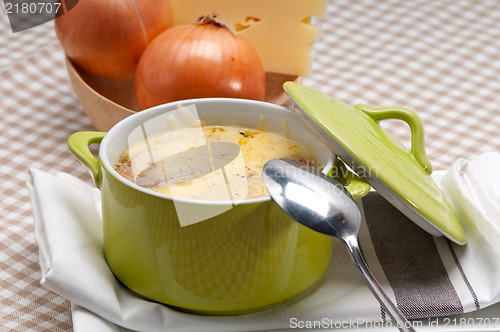 Image of onion soup with melted cheese and bread on top