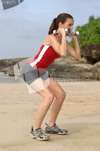 Image of Young woman exercising