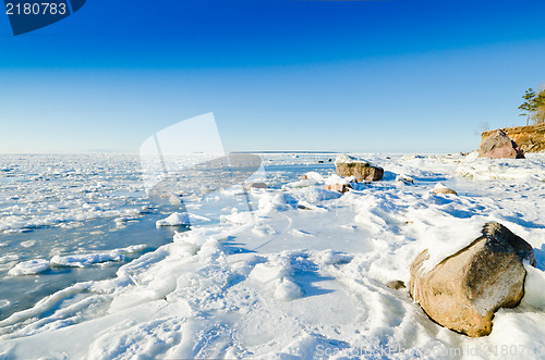 Image of  Stones in the ice on the Baltic Sea coast 