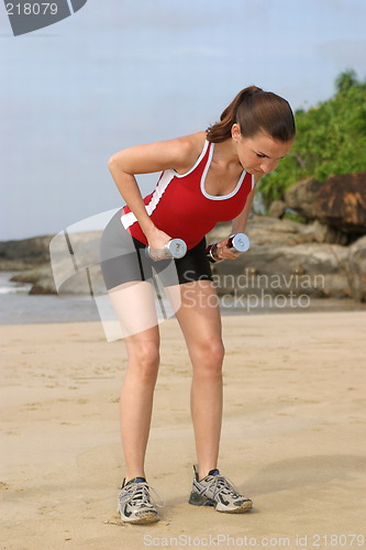 Image of Young woman exercising