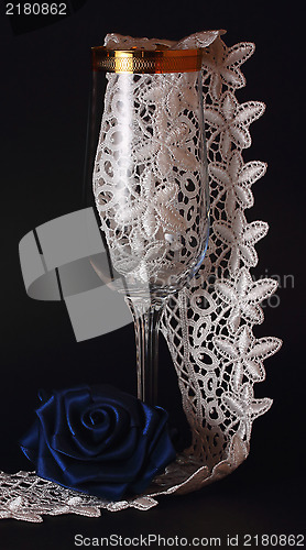 Image of Blue silk rose and glass