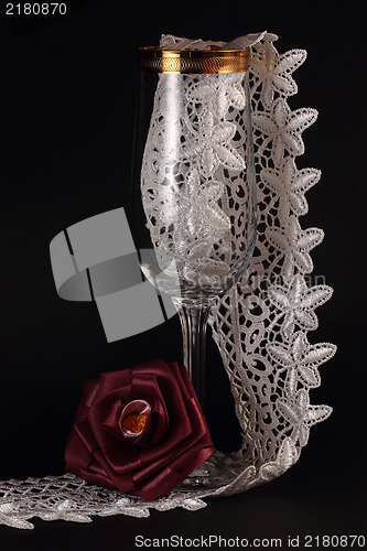Image of Red silk rose and glass