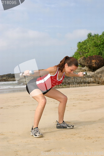 Image of Young woman exercising