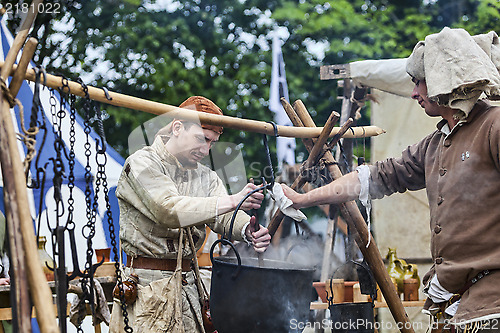 Image of Medieval Men Preparing Food