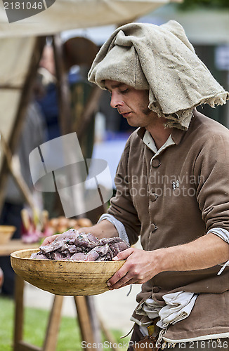 Image of Medieval Man Preparing Food