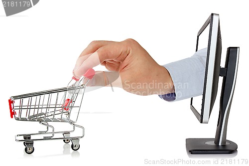 Image of Computer monitor and hand with shopping cart