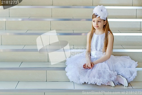 Image of Girl sitting on the steps