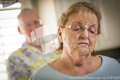 Image of Senior Adult Couple in Dispute or Consoling