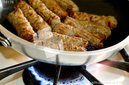 Image of cooking sausages in a pan