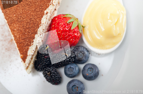 Image of tiramisu dessert with berries and cream