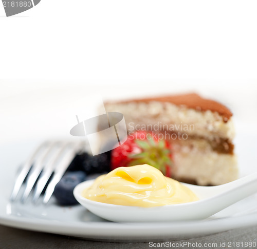 Image of tiramisu dessert with berries and cream