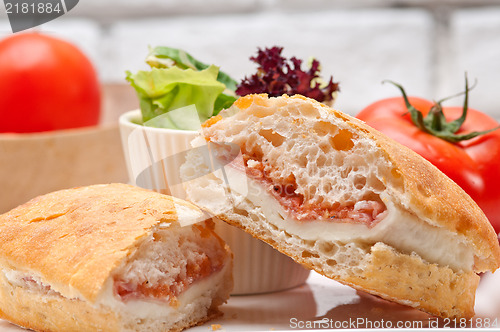 Image of ciabatta panini sandwich with parma ham and tomato