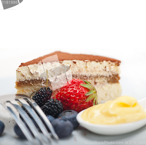 Image of tiramisu dessert with berries and cream