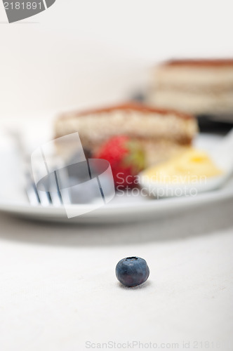 Image of tiramisu dessert with berries and cream