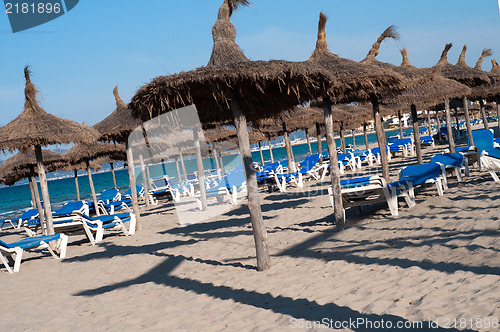 Image of Many chaise longes on the beach