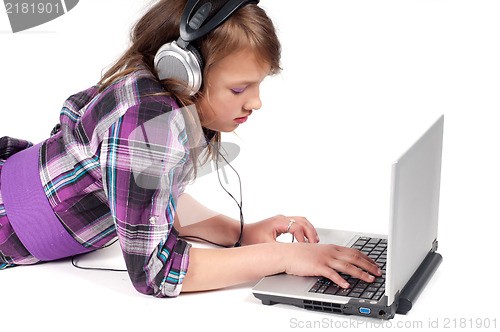Image of Teenager girl in headphones in studio