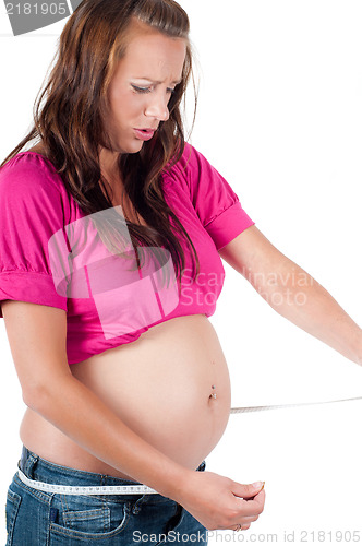 Image of Beautiful pregnant woman with tape-measure