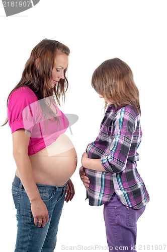 Image of Beautiful pregnant woman with daughter